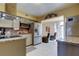 Modern kitchen features stainless steel appliances, light cabinets, and granite countertops at 5820 43Rd N Ter # 1406, St Petersburg, FL 33709