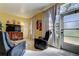 Living room featuring recliner chairs, a TV, and an ample source of natural light at 5820 43Rd N Ter # 1406, St Petersburg, FL 33709