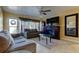 Cozy living room features modern furniture, and a fireplace with a large flatscreen TV at 5820 43Rd N Ter # 1406, St Petersburg, FL 33709