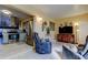 Cozy living room area adjoining the kitchen with tile floors and modern furniture at 5820 43Rd N Ter # 1406, St Petersburg, FL 33709