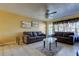 Comfortable living room with modern furniture, light toned walls, and a ceiling fan at 5820 43Rd N Ter # 1406, St Petersburg, FL 33709