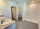 Bathroom featuring double sinks, granite countertops, and a stand-up shower at 8926 Forge Breeze Loop, Wesley Chapel, FL 33545