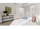 Tastefully decorated bedroom featuring modern furniture, neutral walls, and walk-in closet access at 13929 Lake Fishhawk Dr, Lithia, FL 33547
