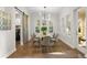 An elegant dining space with natural light and a view of a door to the backyard at 13929 Lake Fishhawk Dr, Lithia, FL 33547