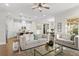 Open-concept living space showcasing hardwood floors, modern decor, and inviting furniture at 13929 Lake Fishhawk Dr, Lithia, FL 33547