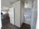 View of a bathroom with a kitchen view, a tub, and closet storage at 418 Henderson Ave, Seffner, FL 33584