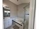 Modern bathroom with shower, toilet, and bright interior at 418 Henderson Ave, Seffner, FL 33584
