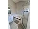 Bright bathroom featuring a soaking tub with black trim and a glass shower enclosure at 418 Henderson Ave, Seffner, FL 33584