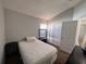 Bedroom featuring neutral walls, carpet and a wardrobe near the entry at 418 Henderson Ave, Seffner, FL 33584