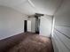Large bedroom boasts vaulted ceilings, neutral paint, and plush carpet at 418 Henderson Ave, Seffner, FL 33584