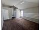 Bedroom featuring neutral paint, plush carpet and natural light from large window at 418 Henderson Ave, Seffner, FL 33584