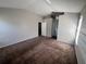Spacious bedroom featuring neutral paint, plush carpet, and ample natural light at 418 Henderson Ave, Seffner, FL 33584
