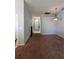 Hallway featuring new carpet and a view of the front door at 418 Henderson Ave, Seffner, FL 33584
