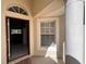 Covered front porch with a view through the doorway to the interior at 418 Henderson Ave, Seffner, FL 33584