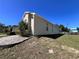 Well-maintained exterior with a round window, providing natural light and architectural interest at 418 Henderson Ave, Seffner, FL 33584