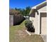 Exterior view of a single Gathering house with a well-kept lawn and wooden fence at 418 Henderson Ave, Seffner, FL 33584