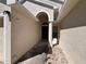 Inviting home entrance featuring a covered walkway, decorative stonework, and well-maintained landscaping leading to the front door at 418 Henderson Ave, Seffner, FL 33584