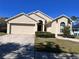 Charming single-Gathering home with a two-car garage and well-maintained front yard at 418 Henderson Ave, Seffner, FL 33584