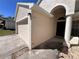 Close up of the house front featuring a driveway, garage, walkway, and a welcoming entrance at 418 Henderson Ave, Seffner, FL 33584