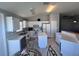 White kitchen featuring an island, white cabinets, and modern appliances at 418 Henderson Ave, Seffner, FL 33584