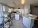 Kitchen featuring white cabinets, island, and modern appliances at 418 Henderson Ave, Seffner, FL 33584