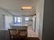 Open kitchen layout with breakfast bar and dining area at 418 Henderson Ave, Seffner, FL 33584