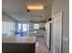 Bright eat-in kitchen with white cabinets, tiled floor, and adjacent dining area at 418 Henderson Ave, Seffner, FL 33584