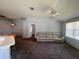 Spacious living room with neutral walls and carpet, and ceiling fan at 418 Henderson Ave, Seffner, FL 33584