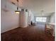 Open-concept living and dining area with updated lighting and neutral decor at 418 Henderson Ave, Seffner, FL 33584
