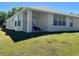 Covered patio with an outdoor seating area, providing a relaxing and shaded space to enjoy the outdoors at 418 Henderson Ave, Seffner, FL 33584