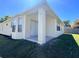 Outdoor covered patio with sliding glass doors, perfect for entertaining and enjoying the beautiful views at 418 Henderson Ave, Seffner, FL 33584