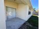 Covered back patio with sliding glass doors, great for enjoying the outdoors while staying protected from the elements at 418 Henderson Ave, Seffner, FL 33584