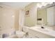 Clean bathroom with a shower-tub combo, white vanity with a decorative mirror, and neutral finishes at 12200 Vonn Rd # 1209, Largo, FL 33774