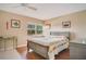 Cozy bedroom featuring a comfortable bed, natural light from the window and soft, neutral-toned walls at 12200 Vonn Rd # 1209, Largo, FL 33774