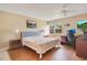 Bright bedroom with hardwood floors, light walls, and a work space for optimal versatility at 12200 Vonn Rd # 1209, Largo, FL 33774