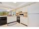 Well-lit kitchen provides plenty of storage and counter space and connects to an open living area at 12200 Vonn Rd # 1209, Largo, FL 33774
