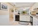 Practical kitchen area with ample counter space and appliances, open to living areas at 12200 Vonn Rd # 1209, Largo, FL 33774
