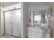 Bathroom includes a large mirror over the vanity, a walk-in shower, and ample lighting at 181 Sportsman Rd, Rotonda West, FL 33947