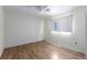 Simple bedroom featuring hardwood floors, white walls, and natural light at 181 Sportsman Rd, Rotonda West, FL 33947