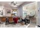 Bright dining room with tile floor, ceiling fan, and sliding glass doors to outside patio at 181 Sportsman Rd, Rotonda West, FL 33947