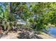 Picturesque waterfront view with lush greenery, creating a serene and inviting atmosphere surrounding the property at 181 Sportsman Rd, Rotonda West, FL 33947