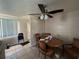 Bright dining area features ceiling fan, tile floors, and a charming round table perfect for Gathering meals at 6312 Fairway Blvd, Apollo Beach, FL 33572