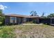 Charming single-story home with a well-maintained front yard and neutral-colored exterior at 7058 Coventry Ter, Englewood, FL 34224