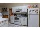 Efficient kitchen with cabinets, standard appliances, and easy access to other rooms at 7058 Coventry Ter, Englewood, FL 34224
