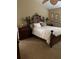 Bedroom featuring a plush bed, elegant furnishings, and neutral color scheme at 4041 Murfield E Dr, Bradenton, FL 34203