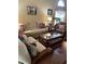 Living room featuring wood floors, sofa and decorative pillows at 4041 Murfield E Dr, Bradenton, FL 34203