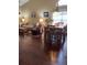 Living room featuring wood floors, table, and seating area at 4041 Murfield E Dr, Bradenton, FL 34203