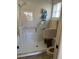 This bathroom includes a fully tiled shower and a glass shower door at 4041 Murfield E Dr, Bradenton, FL 34203