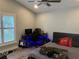 Bedroom with a desk, guitar, and decoratively lit shelving unit, featuring shuttered windows at 4749 Stoneview Cir, Oldsmar, FL 34677