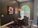 Cozy dining room with dark walls, modern light fixture, and stylish decor at 4749 Stoneview Cir, Oldsmar, FL 34677